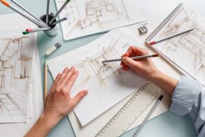Interior designer making hand drawing pencil sketch of a bathroom. Interior design projects concept