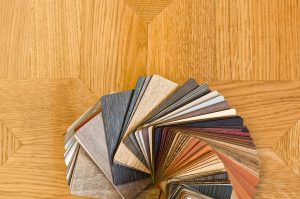 Color samples of wood floor on brown parquet background.