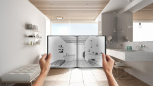 Hands holding notepad with creative bathroom design blueprint sketch or drawing. Real interior design project background. Before and after concept, architect designer work flow idea
