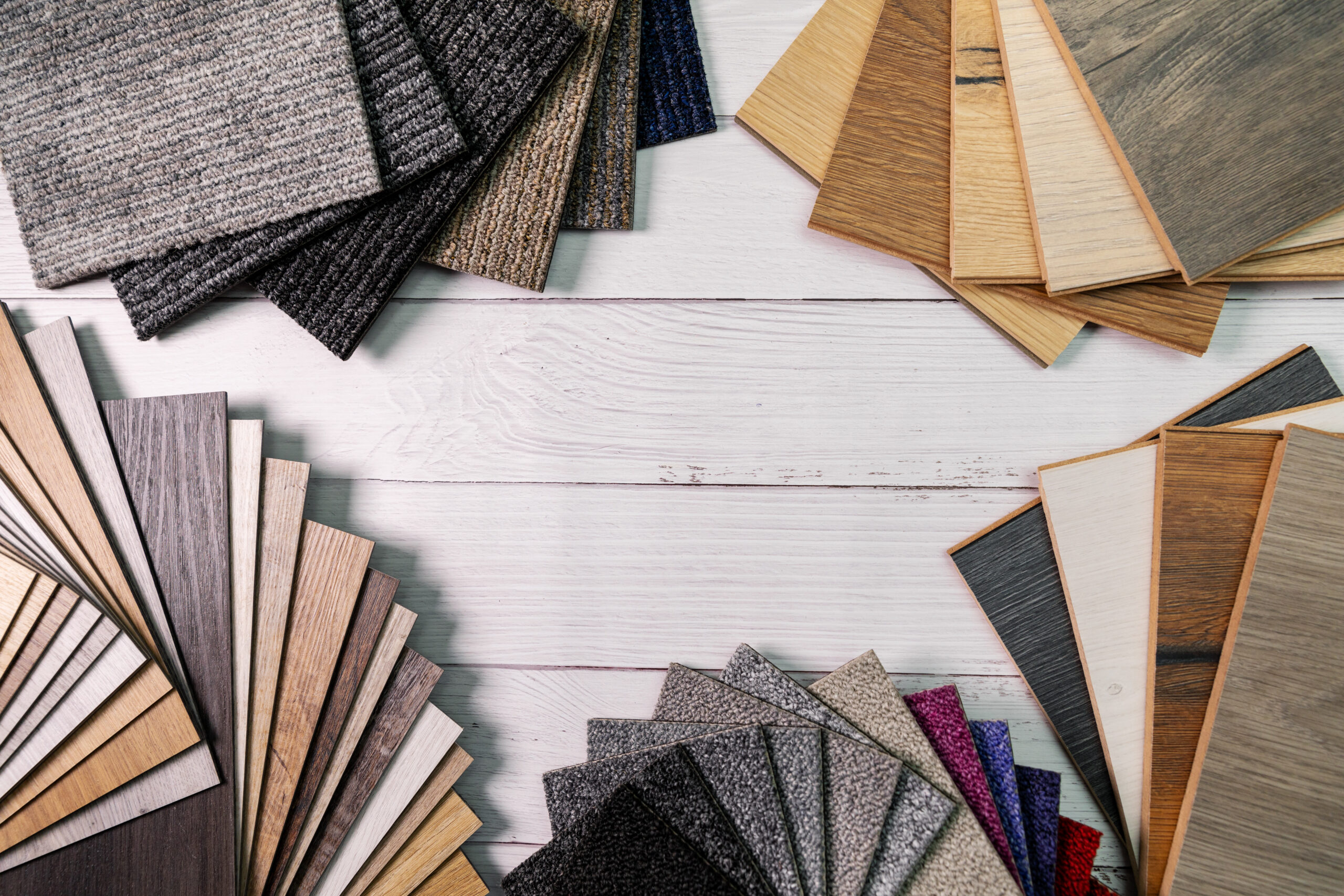 flooring and furniture materials - floor carpet and wooden laminate samples with copy space